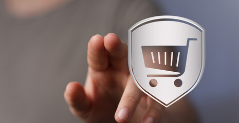 Person's finger pointing at a shield with a shopping cart icon, representing online shopping, security, and digital commerce. E-commerce and saf