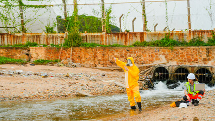Industry professionals monitor environmental impact at a coastal plant. The team tests wastewater discharge, ensuring compliance with sustainable safety standards.