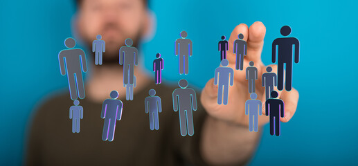 Hand pointing at digitally rendered human figures, representing teamwork, online connection and the idea of soc