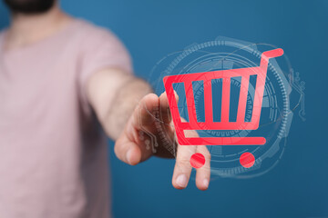 Person interacting with a virtual shopping cart, symbolizing online shopping, e-commerce, and technology.