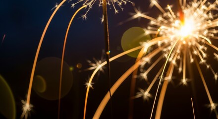 Vibrant fireworks exploding in dark night sky with sparks