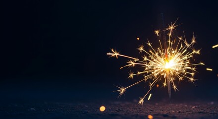 Vibrant sparkler glowing brightly in dark night setting