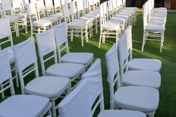 Rows of white chairs mockup with blank fabric. High quality photo
