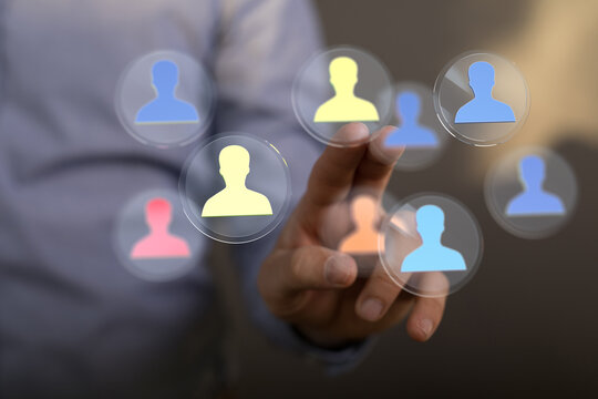 Hand touching digital user icons symbolizing people, connections, and technology. Ideal for social media, networking, and digital concepts. - Powered by Adobe