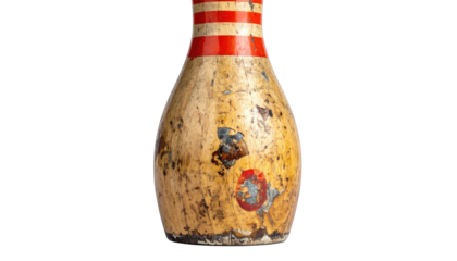 A close-up shot of a weathered bowling pin, showcasing wear and tear against a black background