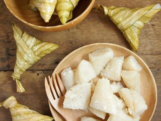 Traditional Indonesian Ketupat for Eid Mubarak on Rustic Wooden Table