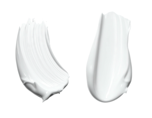 Two smooth, white cosmetic cream strokes with reflective highlights against a black backdrop