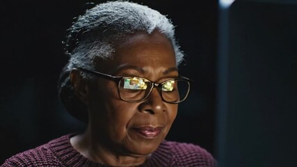 Close-Up of Person’s Face Lit by Computer Screen with Moody Cinematic Lighting and HDR Glasses Reflections