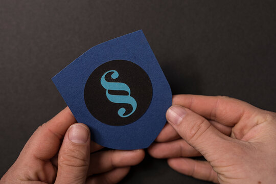 Symbol of Law. Hands holding a shield with paragraph symbol. Legal, Justice, concepts, regulations, and legislat