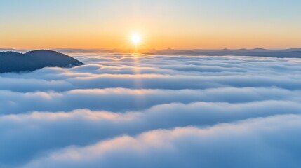Fototapeta premium Sunrise over a sea of clouds.