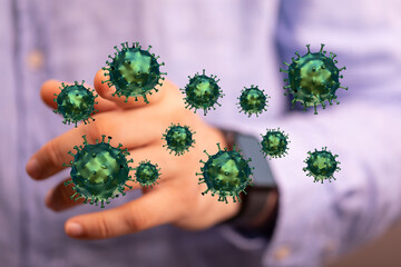 Visual representation of virus spread with a hand interacting with floating coronavirus particles, symbolizing