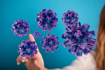 Woman's hand interacts with a virus or germ illustration, symbolizing disease, protection, or...