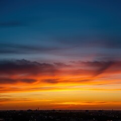 Fototapeta premium Beautiful golden hour sky with dramatic clouds painted orange and pink against the deep blue horizon during the evening ,sky ,blue ,sunset