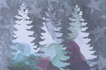 machine-cut paper tree silhouettes on decorative paper with stars