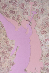 double trumpeting paper angel silhouettes on floral paper