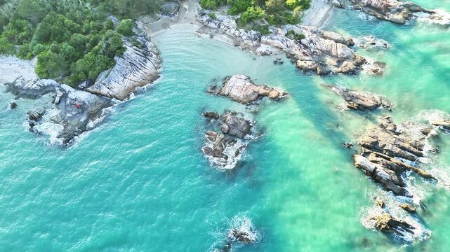 Overhead Drone View of Paradise Coastline with Rocks and Sand