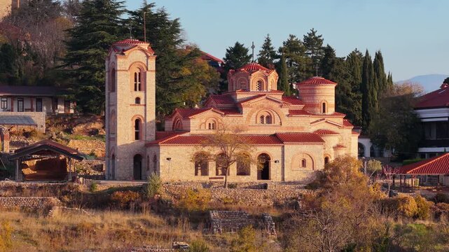 Aerial drone view of the restored St. Clement and Panteleimon Church at Plaosnik, showcasing its Byzantine architecture surrounded by historical ruins. Ohrid, North Macedonia