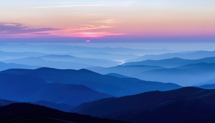 Misty Mountain Layers at Sunrise: Serene Blue Hues and Pink Sky