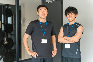 Sports gym, trainer in training gym, male instructor staff