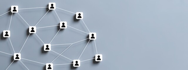 Network of connected people icons on a plain grey background, representing social connections and teamwork