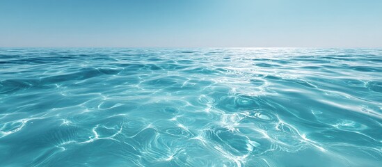 Tranquil Turquoise Ocean Water Sparkling Under Bright Blue Sky