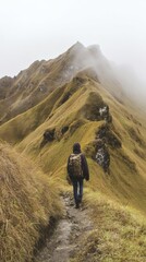 Obraz premium footstep. Lone traveler with backpack on narrow misty mountain trail. tourism brochures, itinerary planners, destination guides, designed for travel destination branding, used by travel agents.