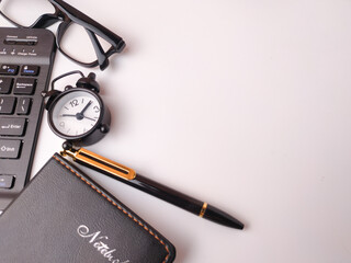 The image displays a collection of office items arranged as a flat lay on a white background