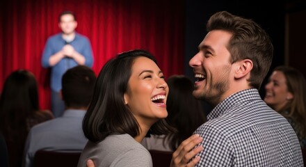 A couple laughing in a theater.