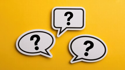 Three white speech bubbles containing question marks float above a bright solid yellow background signifying doubt or inquiry