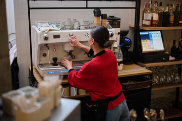 Caf? Owner Operating Espresso Machine In Cozy Caf?, Skilled Barista At Work In Busy Shop