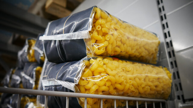 Close-up of many packagings of pasta in a warehouse