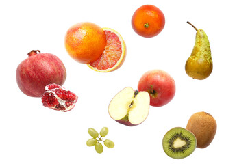 eye-catching fruit arrangement photograph including pomegranates, citrus fruits, apple slices, kiwis, grapes, and pear set against a stark black backdrop.