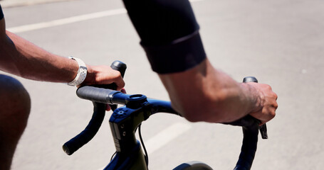 Obraz premium Cycling, hands and athlete on bicycle, outdoor and practice competition on road, active and journey. City, cyclist and person on bike for sport tournament, travel and eco friendly transport on street