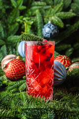 Tasty christmas cocktail with cranberry and foxberry. Shallow depth of field. Selective focus.