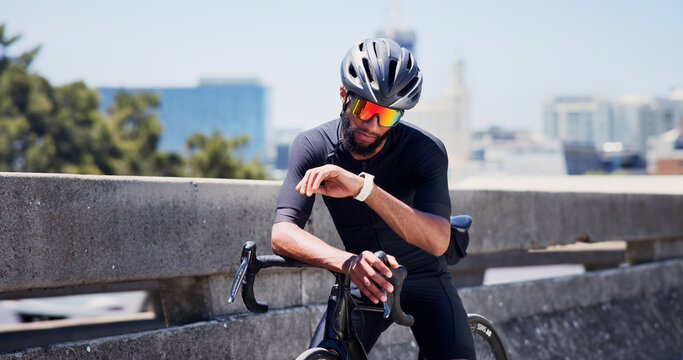 Smart watch, bike and cyclist with man in city for tracking performance, workout stats and health app. Training guide, exercise checklist and tech with person and bicycle outdoor for cycling route - Powered by Adobe