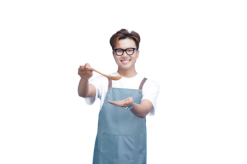 Culinary Craftsmanship: A cheerful individual, radiating with a warmth smile, holds a wooden spoon, appearing to sample a delicious dish, embodying a passion for food and culinary exploration.