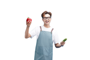 A Chef's Fresh Picks: A cheerful chef proudly displays a vibrant red pepper and a fresh cucumber, embodying a commitment to culinary excellence and healthy eating.