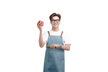 Smiling Person holding fruit: A cheerful person, donning eyeglasses and a blue apron, holding a fresh red apple with a cucumber, embodying the health, wellness and vitality.