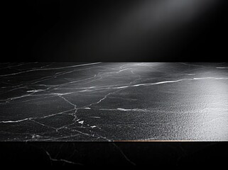 empty black marble tabletop with white veins under a soft spotlight, glossy reflective surface and dark background evoking elegant dramatic luxurious mood