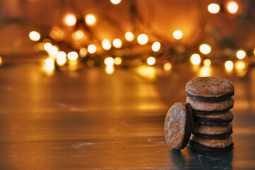 Closeup of cookies and Christmas lights in background