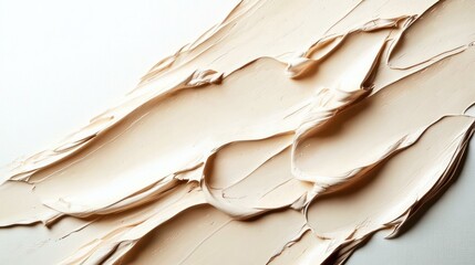 Naklejka premium creamy beige strokes of thick paint spread in flowing ribbons across a white surface, smooth layered texture conveying calm minimal elegance and soothing tactile warmth