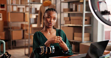 Online, vlog and woman with jewelry, small business and product promotion on social media or website. Influencer marketing, brand awareness and black person with smartphone for video and ring light