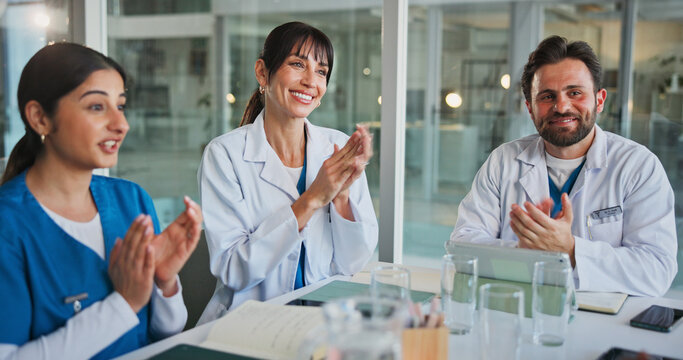 Doctor, applause and happy people in hospital, healthcare and celebration with teamwork. Medical service, women and man in clinic, clapping or achievement with wellness, meeting or goals with support