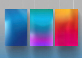 Three abstract gradient posters hanging on a wall with soft shadows