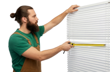 Man installing or adjusting window blinds using level tool isolated transparent background