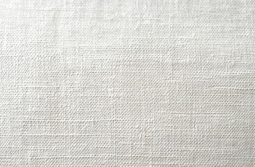 Fototapeta premium close-up of white canvas fabric with visible weave texture, neutral minimalist surface conveying calm simplicity