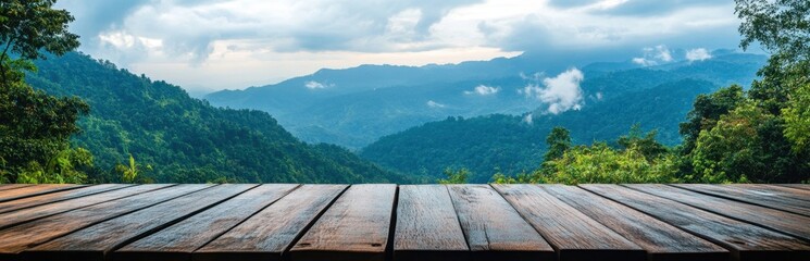 Scenic Mountain View from Wooden Deck with Lush Green Foreground