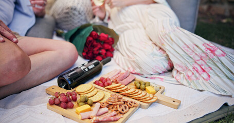 Couple, partner and charcuterie board with wine for picnic, date and bonding together with healthy...