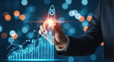 Close-up of a hand in a suit touching a digital rocket graphic symbolizing a business launch and growth. Features a bar chart and blurred city lights.