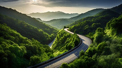 Serene mountain road winding through lush forest